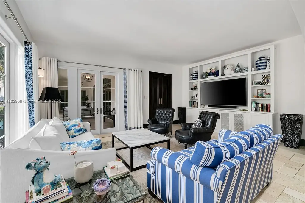 Luxury waterfront estate at 3305 S Moorings Way, Miami, FL 33133 with private dock, pool, 7 bedrooms, 9 bathrooms, and panoramic Biscayne Bay views.
