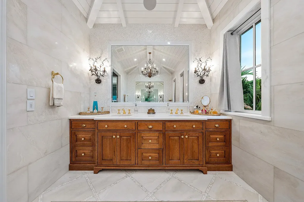 Front exterior of 518 Harbor Court Delray Beach luxury home for sale with European-inspired architecture and lush landscaping