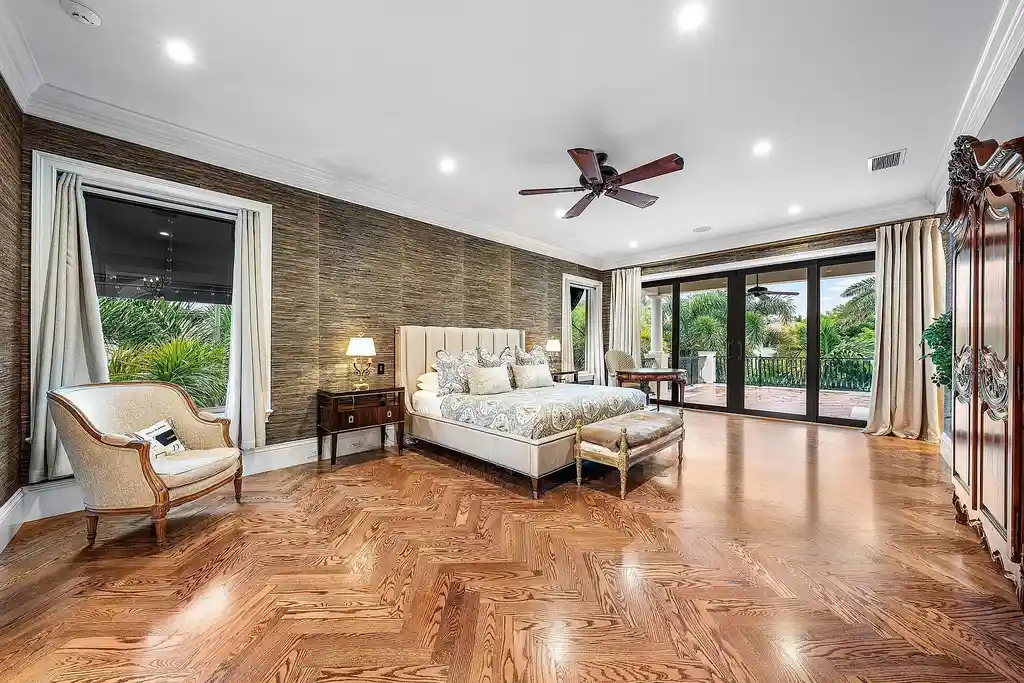Front exterior of 518 Harbor Court Delray Beach luxury home for sale with European-inspired architecture and lush landscaping