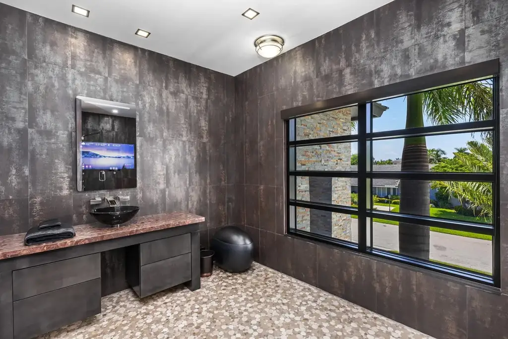 839 NE Bay Isle Drive luxury waterfront home in Boca Raton featuring modern architecture, saltwater pool, and direct ocean access
