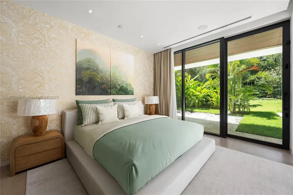 Aerial view of the $31.5M ultra-luxury waterfront mansion at 9440 Old Cutler Lane in Coral Gables, showcasing private dock and lush landscaping