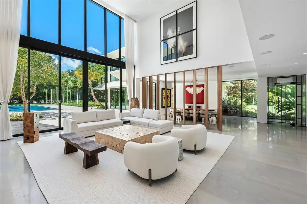 Aerial view of the $31.5M ultra-luxury waterfront mansion at 9440 Old Cutler Lane in Coral Gables, showcasing private dock and lush landscaping