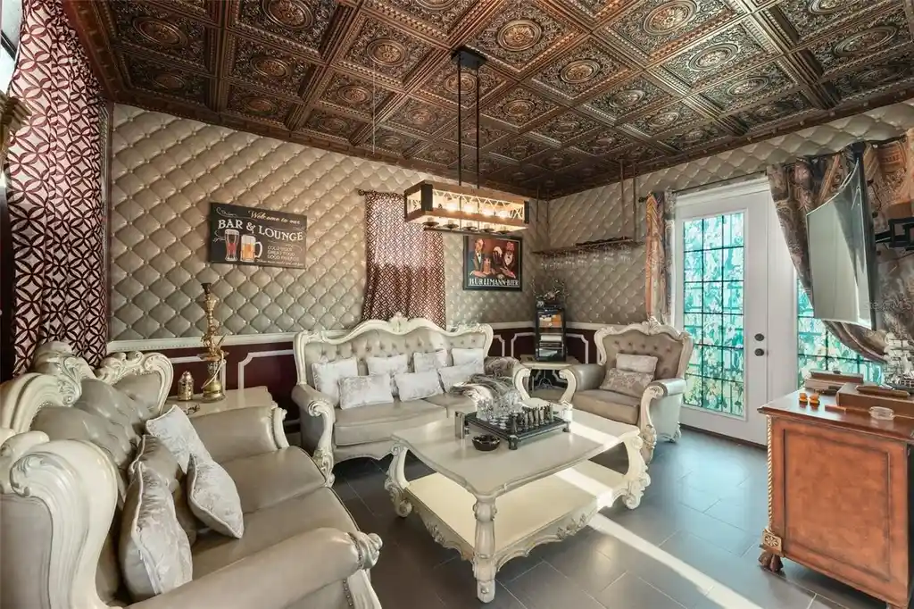 Spacious marble-floor living room with soaring ceilings and lake views inside 9639 Westover Roberts Rd luxury home in Windermere FL