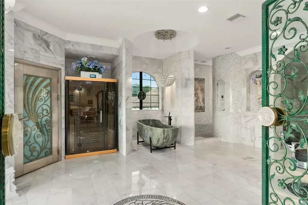 Spacious marble-floor living room with soaring ceilings and lake views inside 9639 Westover Roberts Rd luxury home in Windermere FL