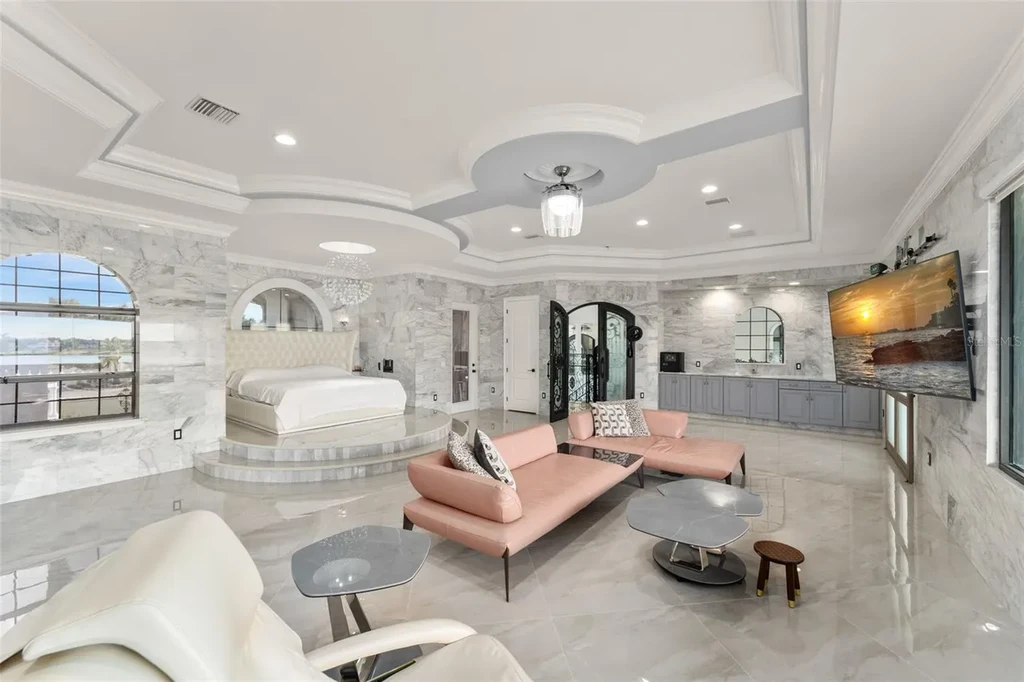 Spacious marble-floor living room with soaring ceilings and lake views inside 9639 Westover Roberts Rd luxury home in Windermere FL