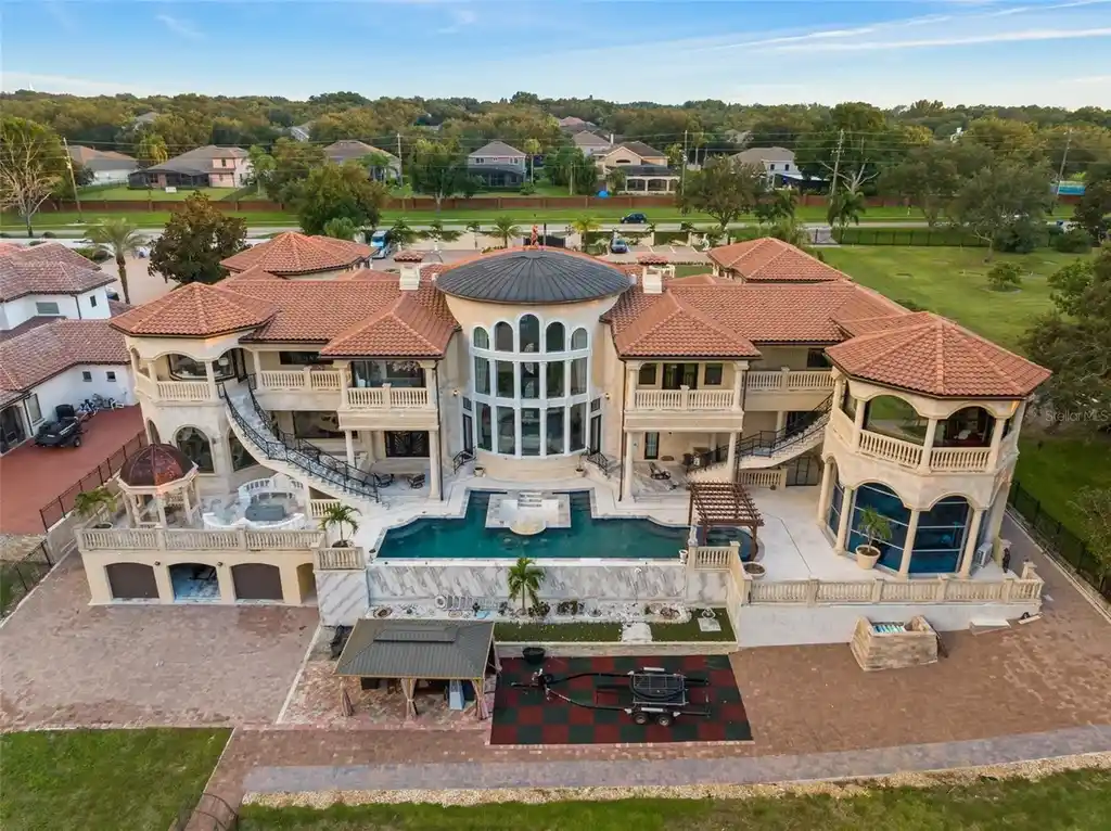 Spacious marble-floor living room with soaring ceilings and lake views inside 9639 Westover Roberts Rd luxury home in Windermere FL