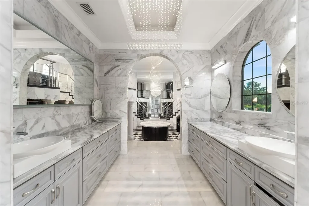 Spacious marble-floor living room with soaring ceilings and lake views inside 9639 Westover Roberts Rd luxury home in Windermere FL