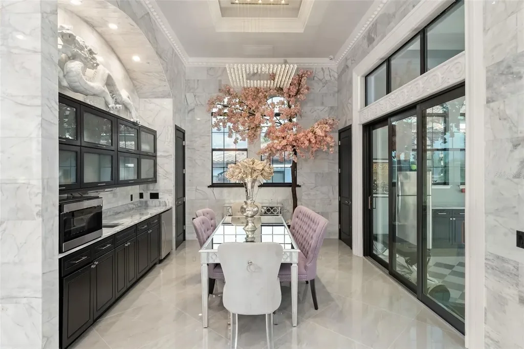 Spacious marble-floor living room with soaring ceilings and lake views inside 9639 Westover Roberts Rd luxury home in Windermere FL