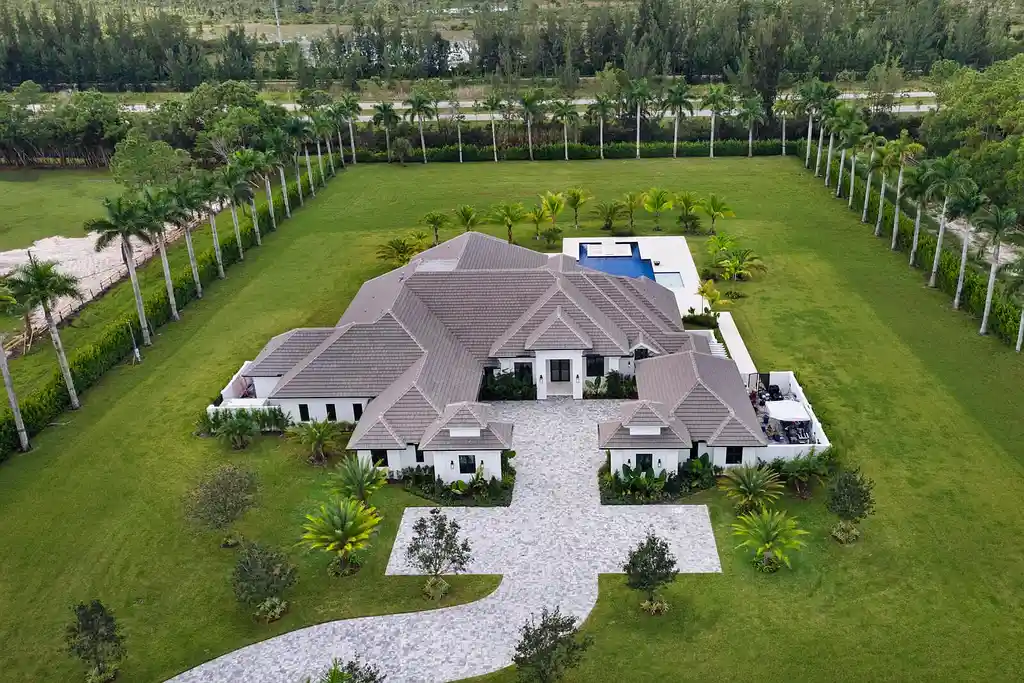 Front view of 14699 Black Bear Road Palm Beach Gardens luxury estate with 6 bedrooms and 6 bathrooms