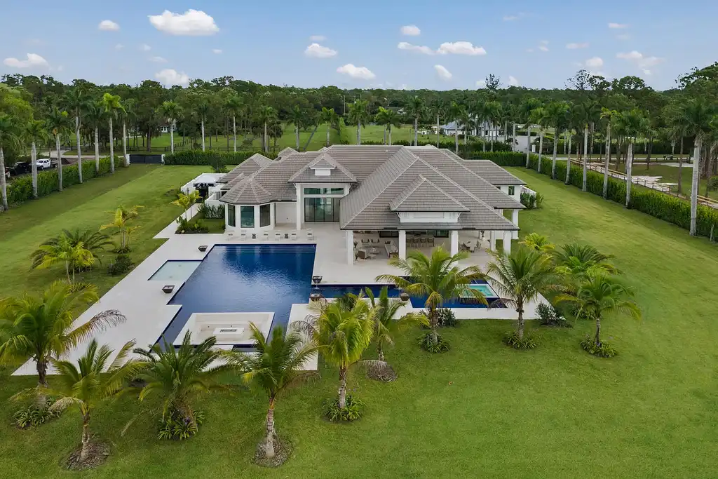 Front view of 14699 Black Bear Road Palm Beach Gardens luxury estate with 6 bedrooms and 6 bathrooms