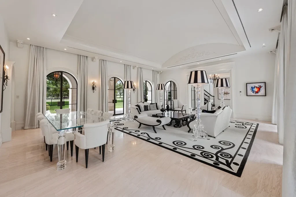 Outdoor living space with heated saltwater pool, cabana, and manicured gardens overlooking golf course